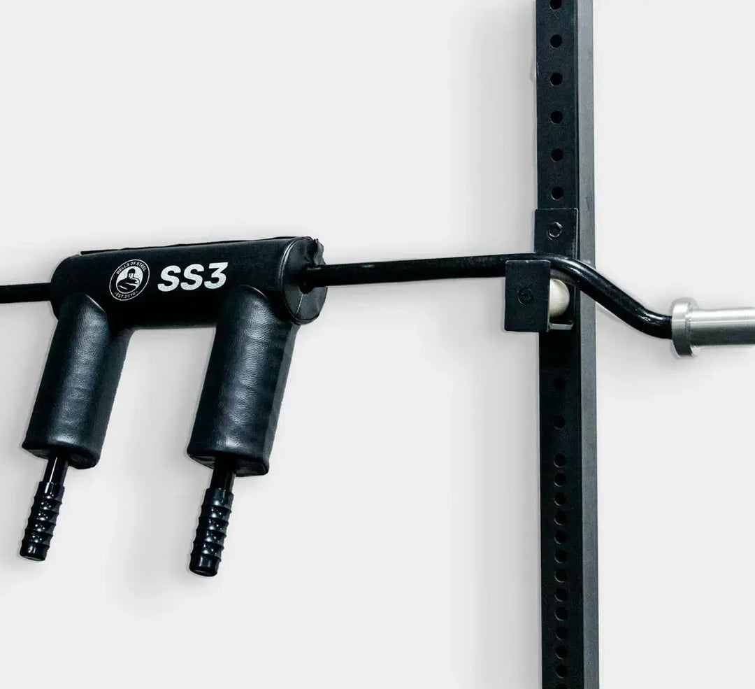 StrongArm Safety Squat Bar SS3 mounted on a squat rack, designed for improved comfort in strength training.