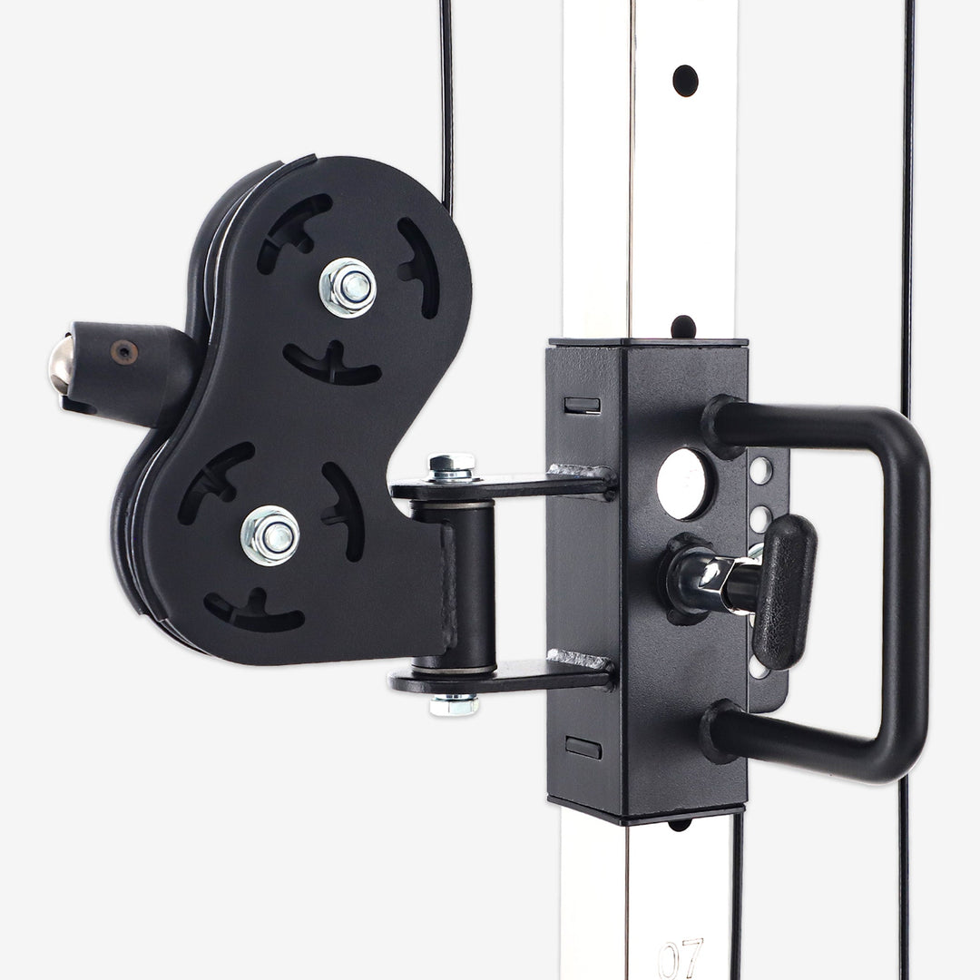 Black pulley system attached to a white wall
