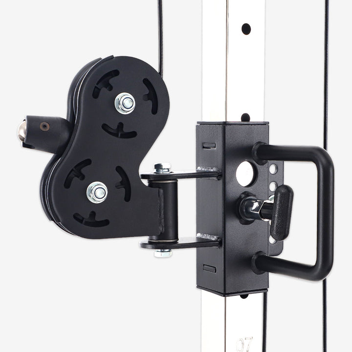 Black pulley system attached to a white wall