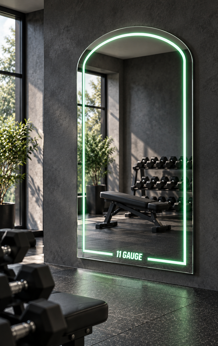 MR1000 green illuminated arch mirror in a gym setting — display illustration