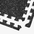 Interlocking rubber mat close-up, featuring a non-slip surface ideal for gym equipment like treadmills and weights.