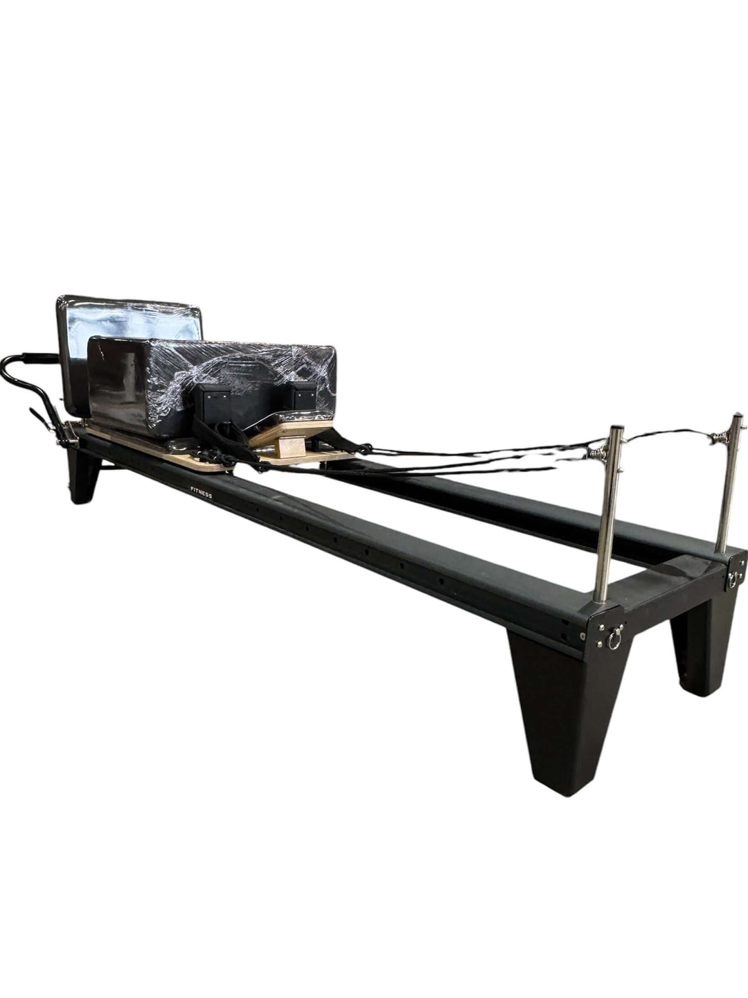Pilates Reformer M, a versatile gym equipment enhancing strength training and flexibility for home or commercial use in Calgary.