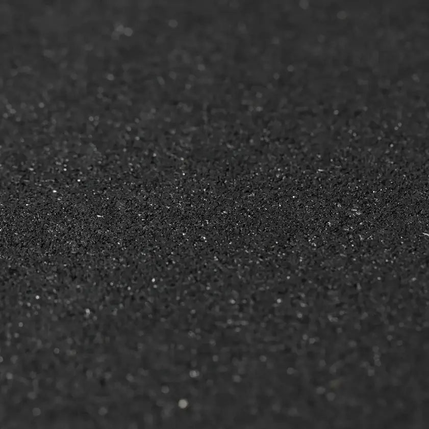 Close-up of a textured black rubber sport mat, ideal for fitness and therapeutic use, suitable for gym equipment in Calgary.