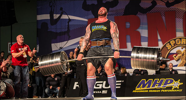 StrongArm Elephant Bar being used in a strongman competition, showcasing its performance in strength training.