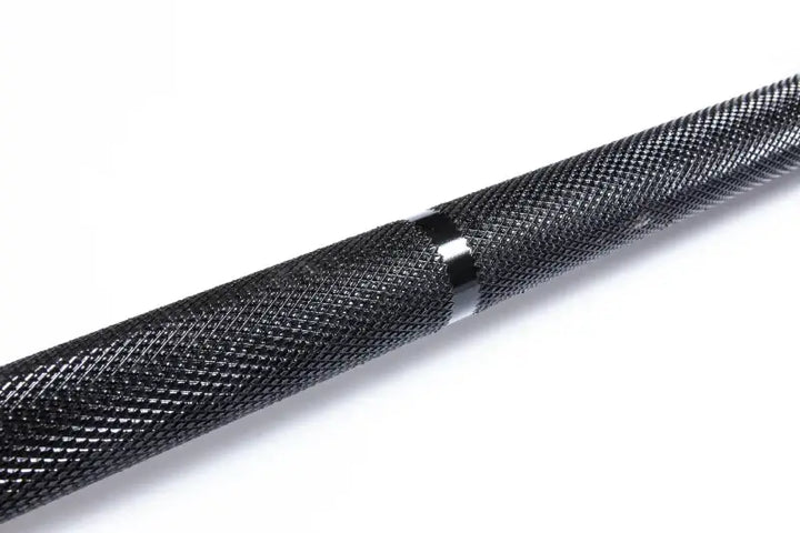 Close-up of the StrongArm Standard Bar with black zinc plating, ideal for weight training and powerlifting in Calgary.