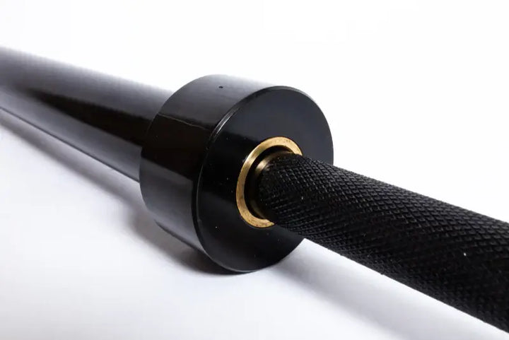 Close-up of StrongArm Standard Bar's knurled grip and black zinc plating, ideal for beginners in weight training.