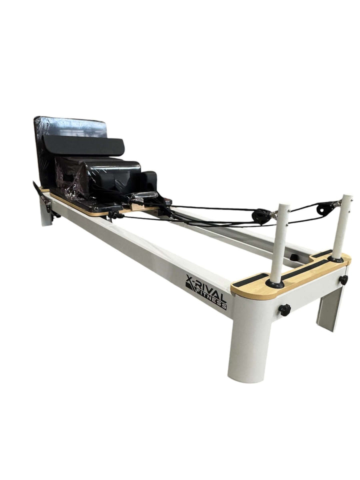 Pilates Reformer S from X-Rival Fitness, ideal for strength training and enhancing flexibility in a home or commercial gym.