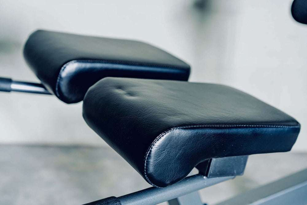 Close-up of X-RIVAL ARC30 Roman Chair padded supports for targeted core strength training in Calgary fitness equipment.